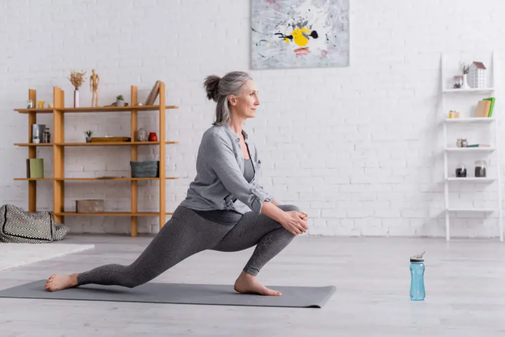 older woman in yoga pose